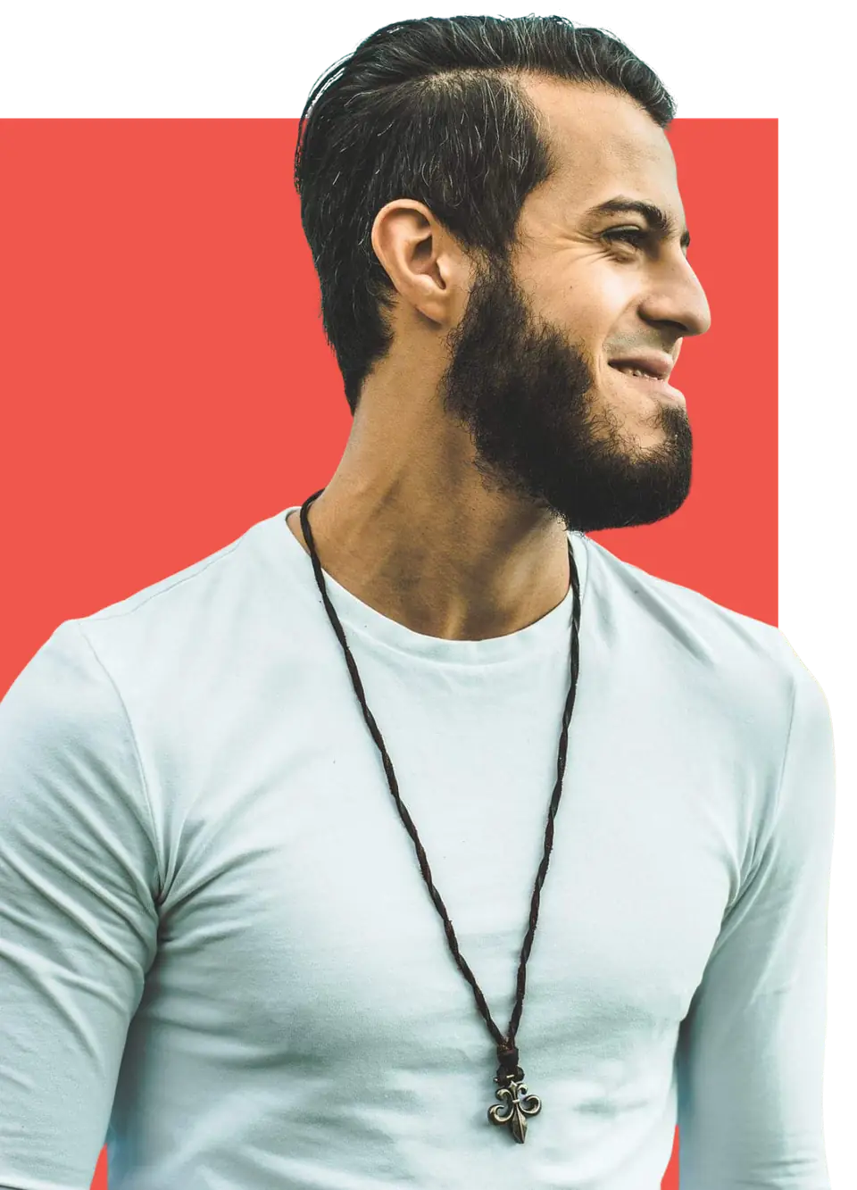 Alyaman Alhayek, web designer and SEO specialist, smiling against a coral background
