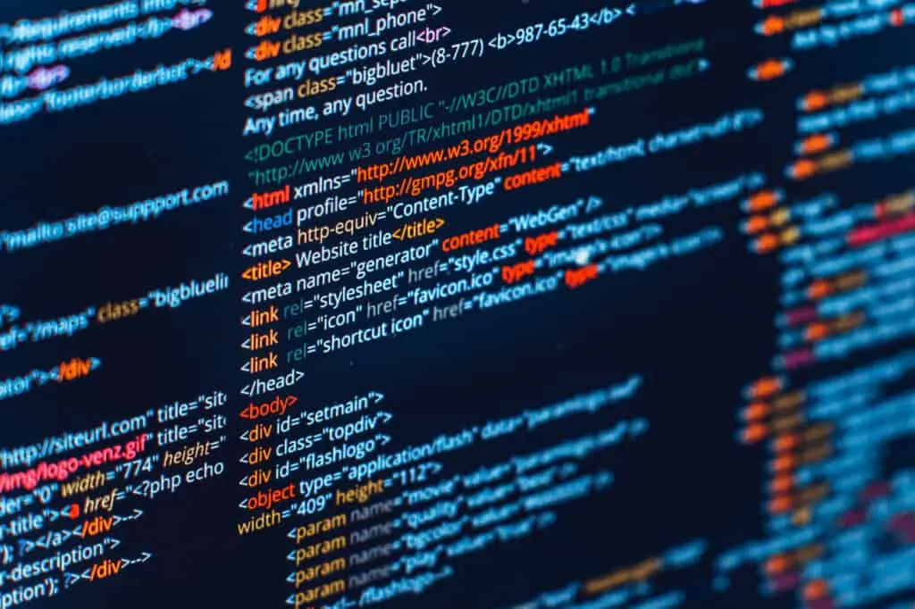 Lines of colorful HTML code on a dark computer screen.
