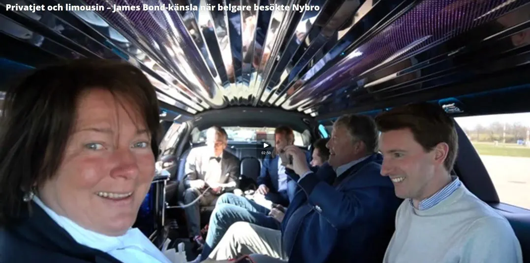 Museum website header photo of smiling people riding inside a limousine.